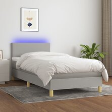 Boxspring met matras en LED stof lichtgrijs 90x200 cm